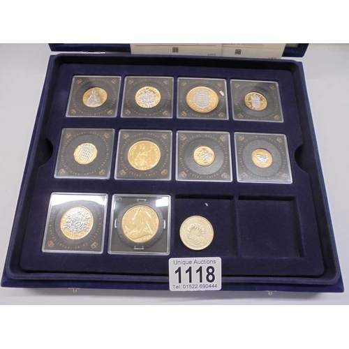 1118 - Eight cased Queen Elizabeth II gold plated coins and a Victorian coin.