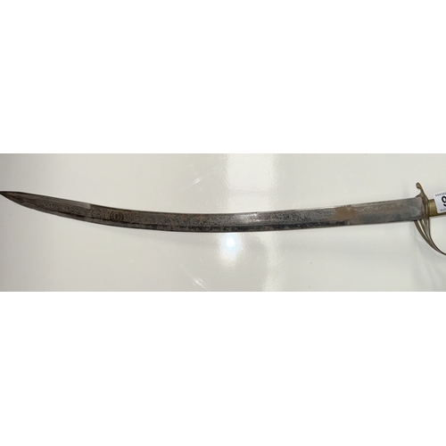 696 - An Indian made sword with brass fittings