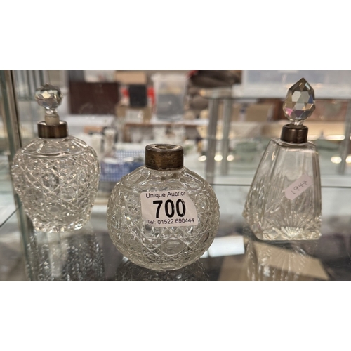 700 - 3 Cut glass perfume bottles with silver collars