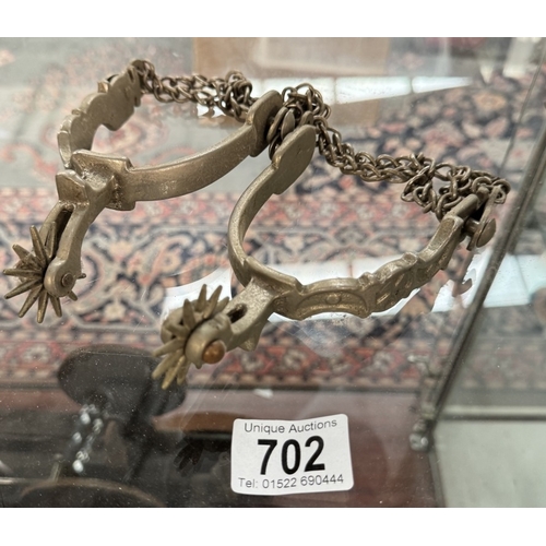 702 - A pair of horse riding spurs