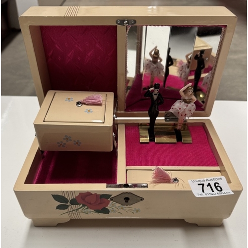 716 - A vintage musical jewellery box