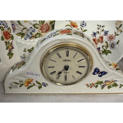 747 - An Aynsley clock, picture frame & 2 plates