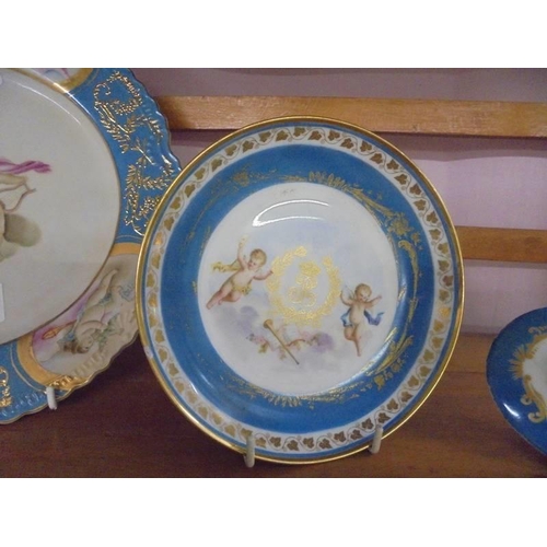 1303 - A continental porcelain hand painted cabinet plate, dish and plaque.