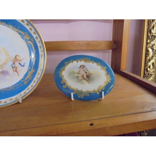 1303 - A continental porcelain hand painted cabinet plate, dish and plaque.