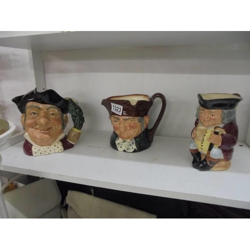 1323 - Two Royal Doulton character jugs and a Royal Doulton Toby jug.