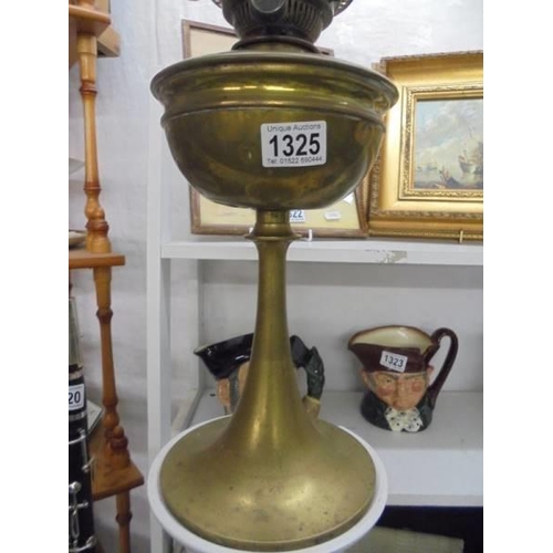 1325 - A brass oil lamp with a tulip shade. COLLECT ONLY.