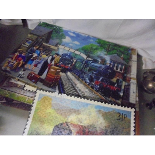 1328 - A quantity of made train related jigsaw puzzles.