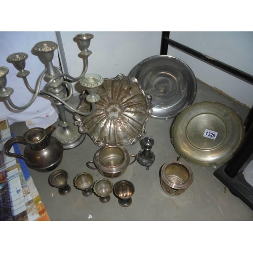 1329 - A mixed lot of silver plate including dishes, candelabra etc.,