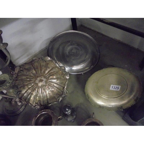 1329 - A mixed lot of silver plate including dishes, candelabra etc.,