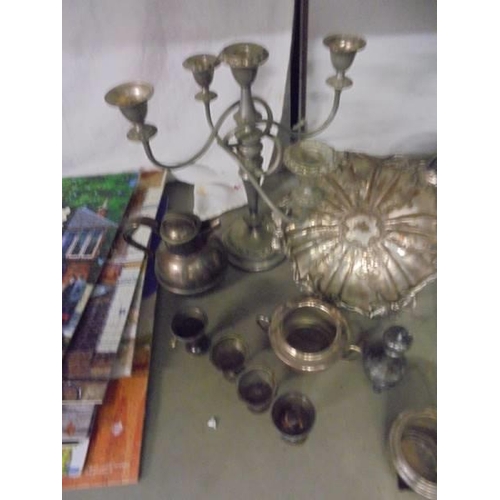 1329 - A mixed lot of silver plate including dishes, candelabra etc.,