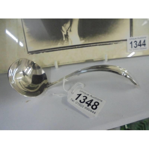 1348 - A small silver plate sauce ladle.