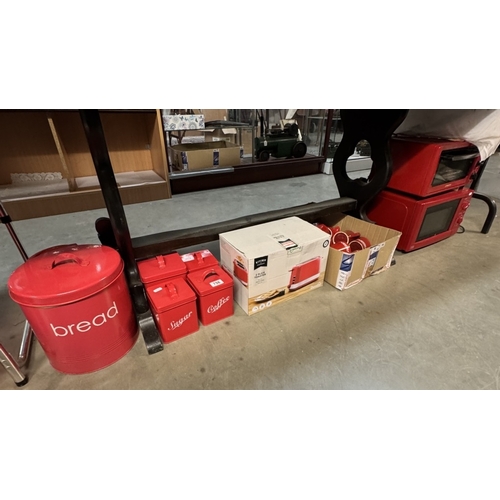 756 - A quantity of red kitchenware including Microwave, grill, toaster etc & A quantity of Nescafe items ... 