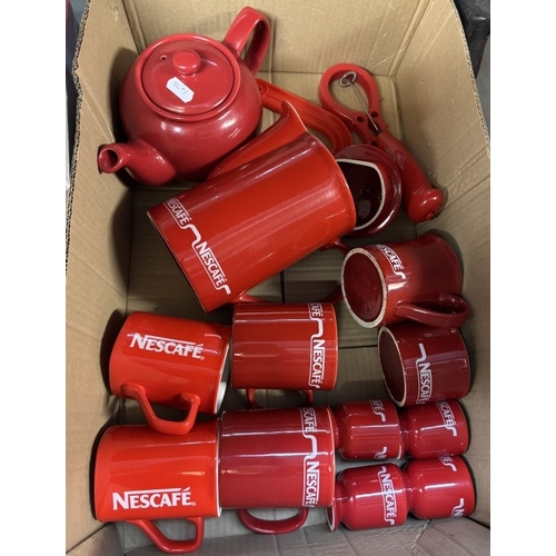 756 - A quantity of red kitchenware including Microwave, grill, toaster etc & A quantity of Nescafe items ... 