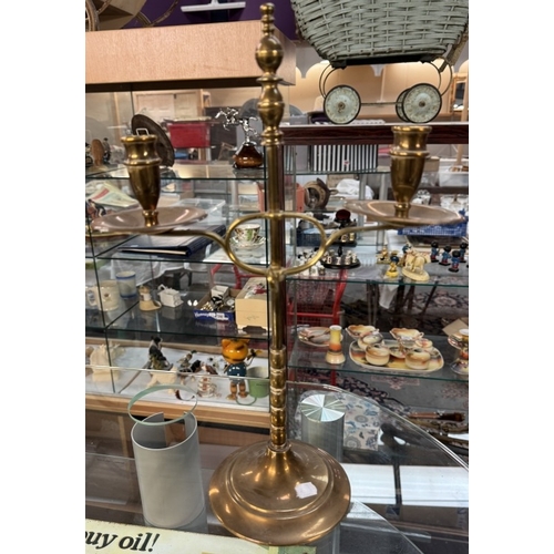 759 - An adjustable brass twin candlestick & a silver plated candlestick