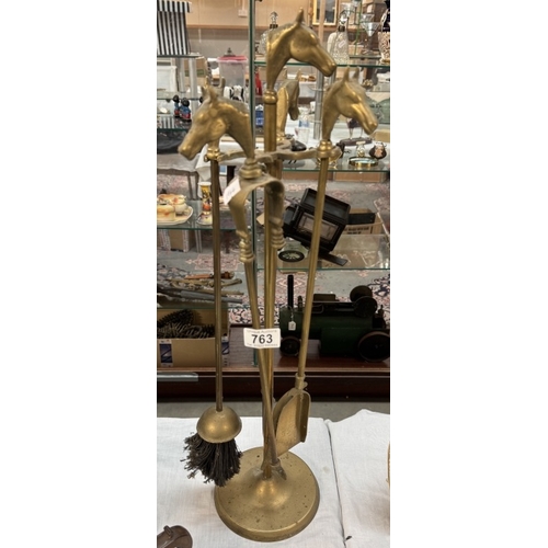 763 - A brass fire companion set A/F with horse head finials