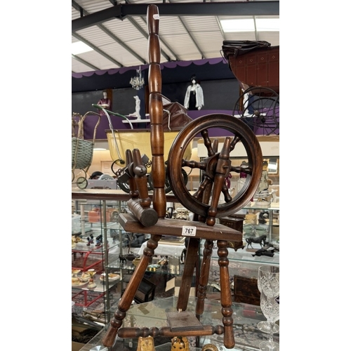 767 - A spinning wheel. Height 92cm