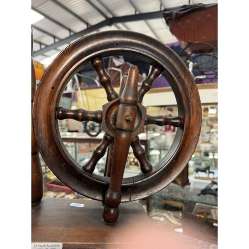 767 - A spinning wheel. Height 92cm