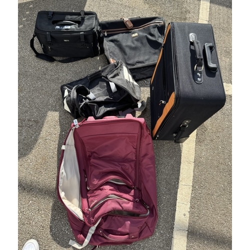 794 - A quantity of suitcases including a suit hanger