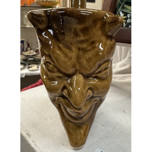 812 - A studio pottery pipe with a devil head bowl