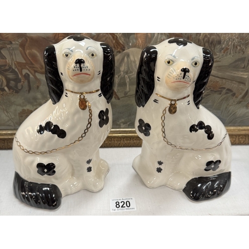 820 - A pair of 20th century Staffordshire dogs.