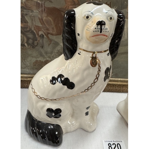 820 - A pair of 20th century Staffordshire dogs.