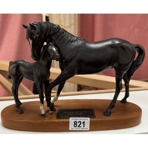 821 - A Black Beauty And Foal, A connoisseur model by Beswick