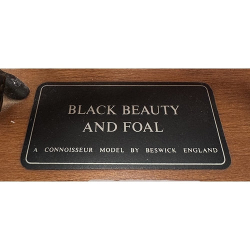 821 - A Black Beauty And Foal, A connoisseur model by Beswick