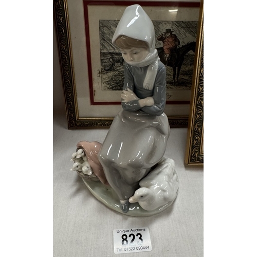 823 - A Lladro figure of girl with goose & goslings