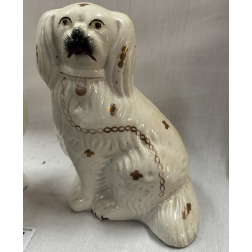 857 - A pair of mid 20th century Staffordshire spaniels.