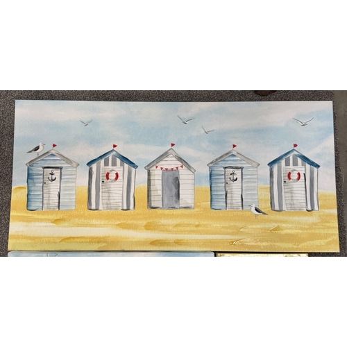 870 - 2 Prints on canvas of beach huts & 1 other