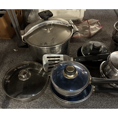 873 - A large quantity of stainless steel saucepans