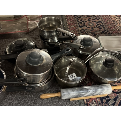 873 - A large quantity of stainless steel saucepans