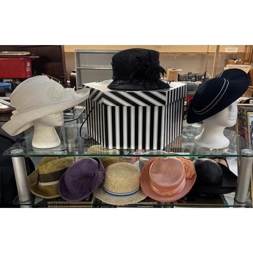 880 - A quantity of vintage hats & a hat box