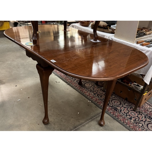 908 - A mahogany drop leaf table on Queen Anne legs