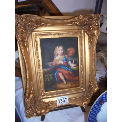 1357 - A gilt framed overpainted print of a young girl with a dog.