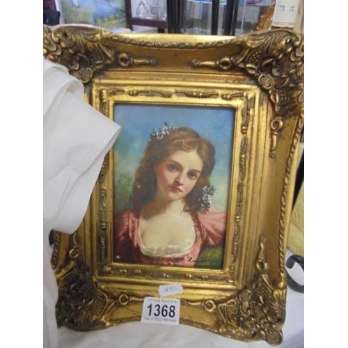 1368 - A gilt framed over painted print of a young lady.