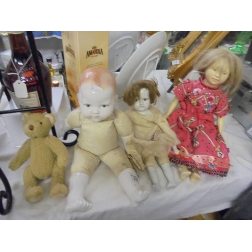 1369 - Three vintage dolls and a Teddy bear.