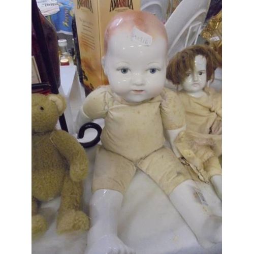 1369 - Three vintage dolls and a Teddy bear.