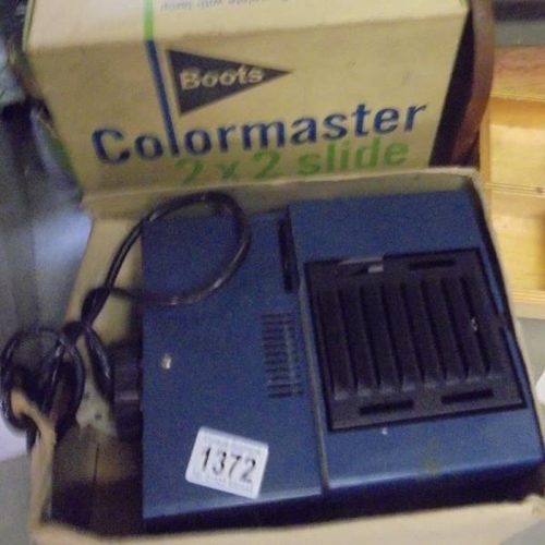 1372 - A boxed Boots Colourmaster slide projector.