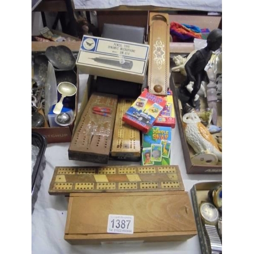 1387 - A mixed lot including crib boards, dominoes, pencil boxes, playing cards etc.,