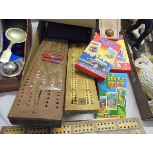 1387 - A mixed lot including crib boards, dominoes, pencil boxes, playing cards etc.,