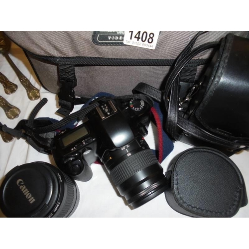 1408 - A cased Canon camera with accessories.