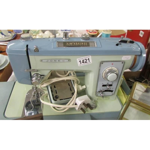 1421 - A cased Jones electric sewing machine, COLLECT ONLY.