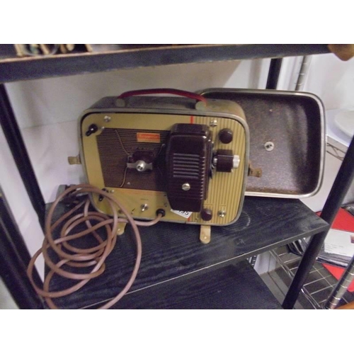 1495 - A cased Brownie 8 x 58 projector.