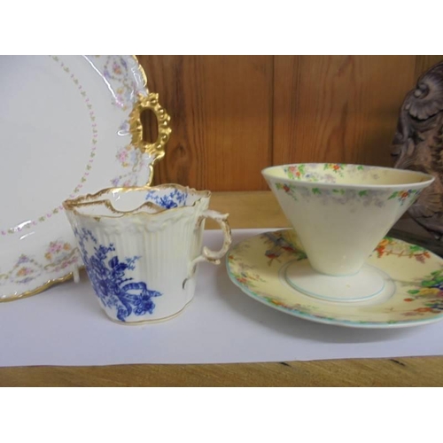 1511 - Two plates, a moustache cup and a tea cup and saucer.