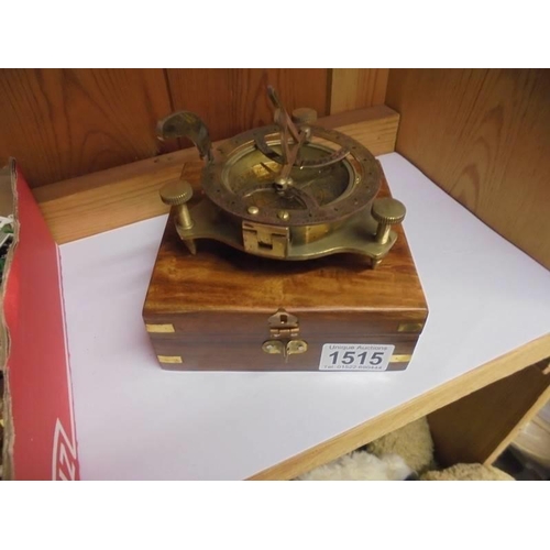 1515 - A small brass sextant in wooden case.