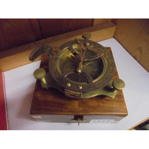 1515 - A small brass sextant in wooden case.