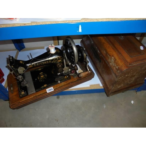 1564 - A vintage cased Gritzner hand operated sewing machine. COLLECT ONLY.