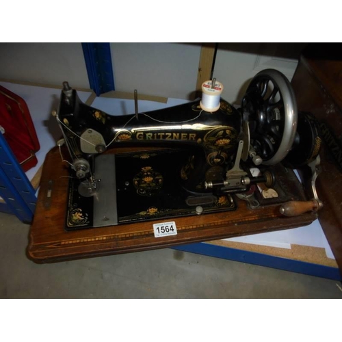 1564 - A vintage cased Gritzner hand operated sewing machine. COLLECT ONLY.