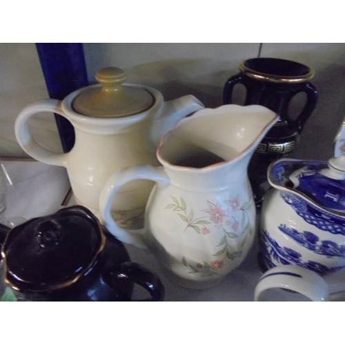 1586 - A mixed lot of teapots, jug etc.,